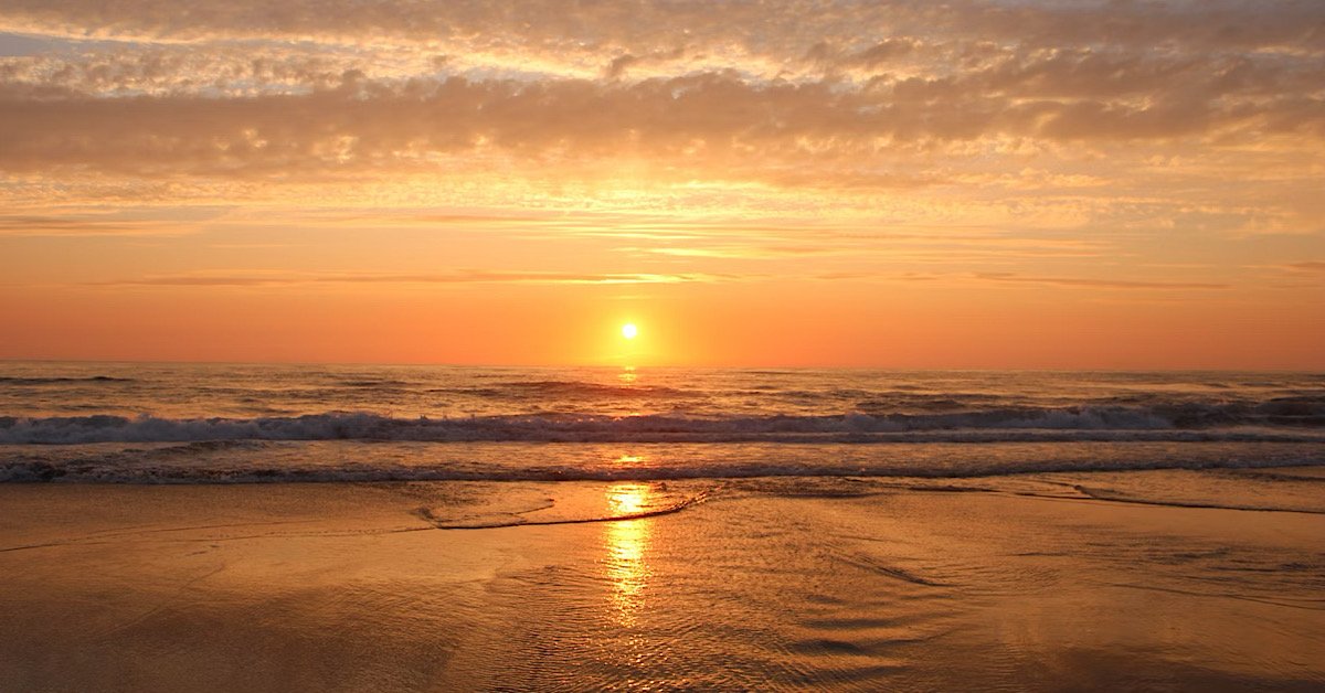 Florida sunset at beach with waves in ocean