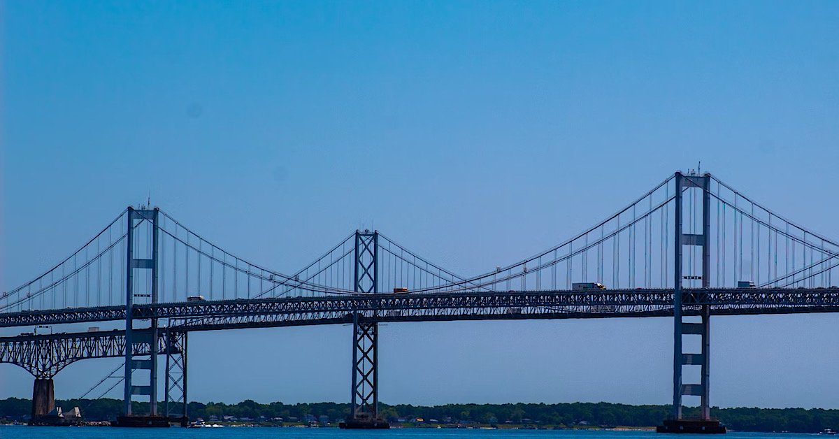 Chesapeake Bay Bridge in Maryland spanning over blue water under a clear daytime sky