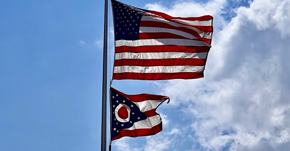 Ohio state flag with United States flag, symbolizing Ohio car insurance requirements