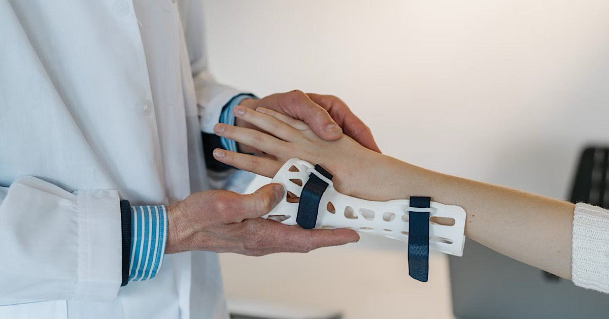 Personal injury protection insurance, doctor putting brace on patients hand