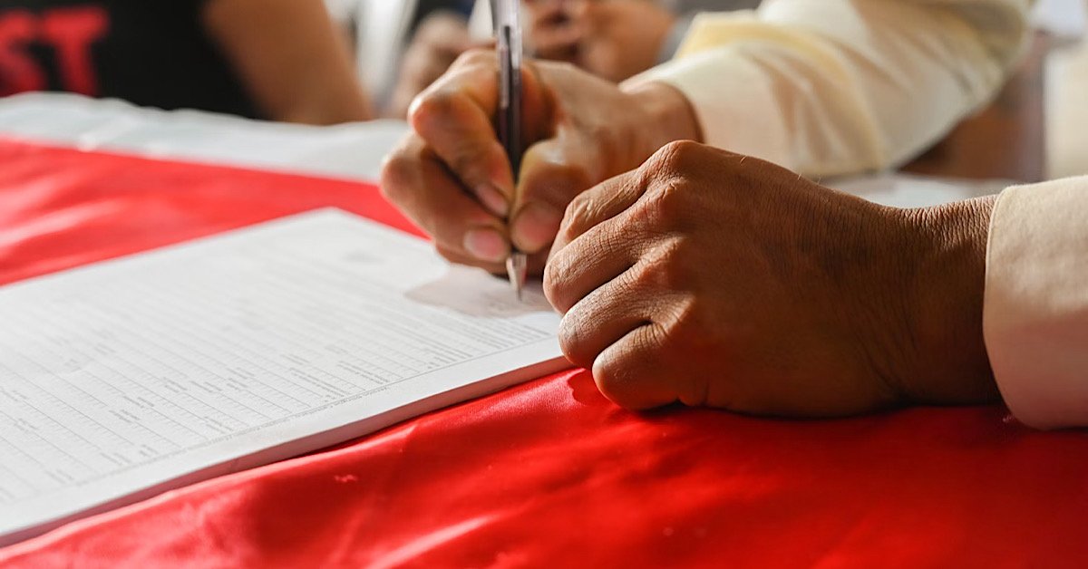 Premium factors car insurance depicted by signing paperwork