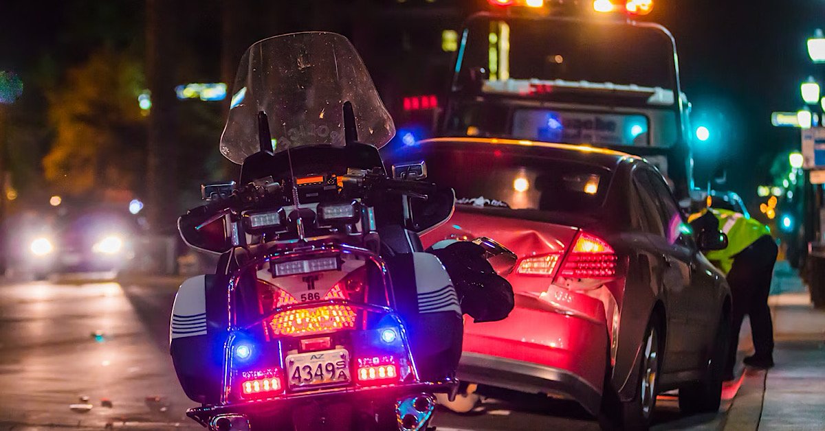 Uninsured motorist car accident depicted by police questioning driver